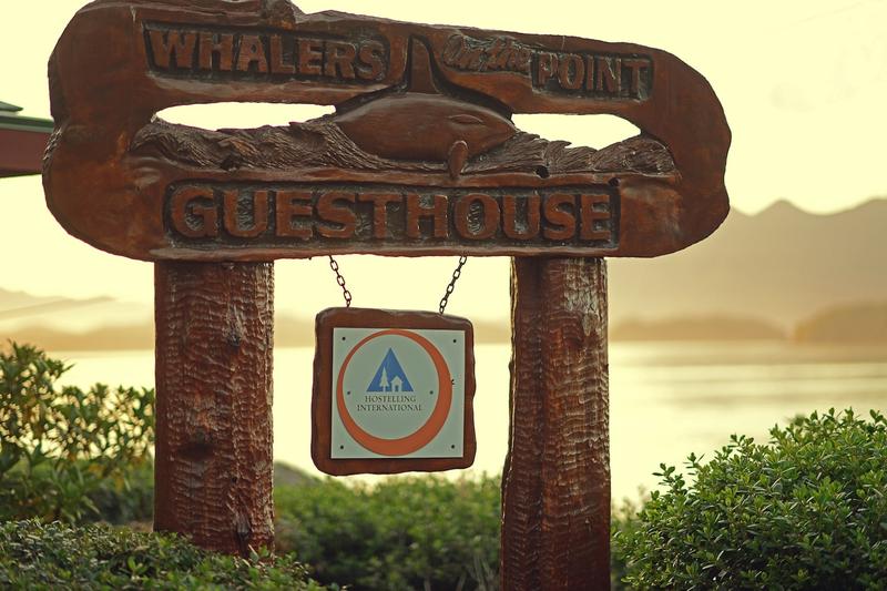 8 sign, whalers guest house Scene Carved Orca Jumping.