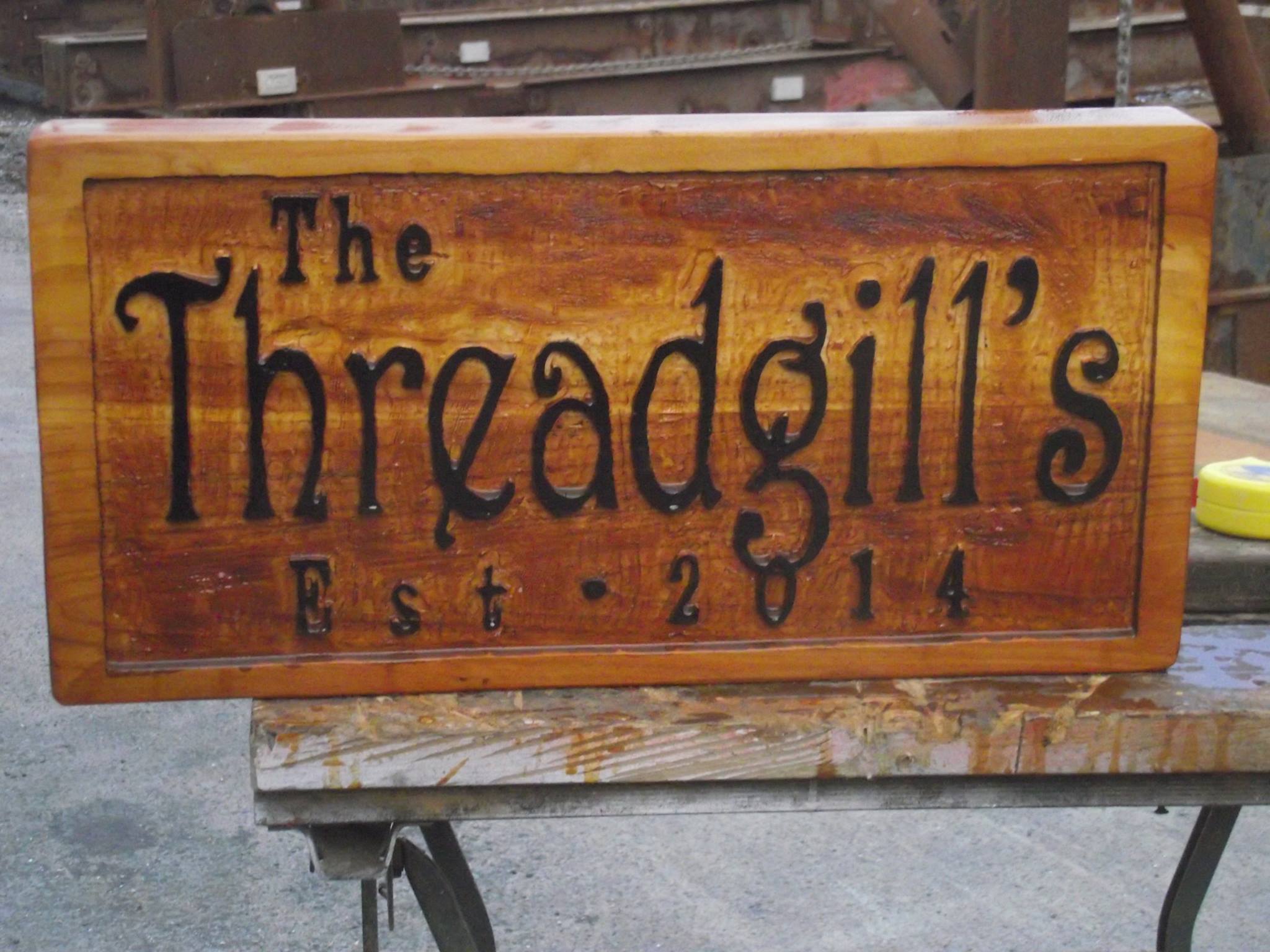 Thread and Gills Sign: Delicate font on cedar sign.
